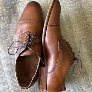 Aldo men’s dress shoes size 10.5. Never worn, they are too small.